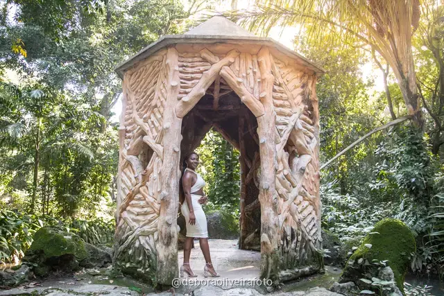 Two women in white at the carved stone gazebo in Parque Lage, Rio de Janeiro