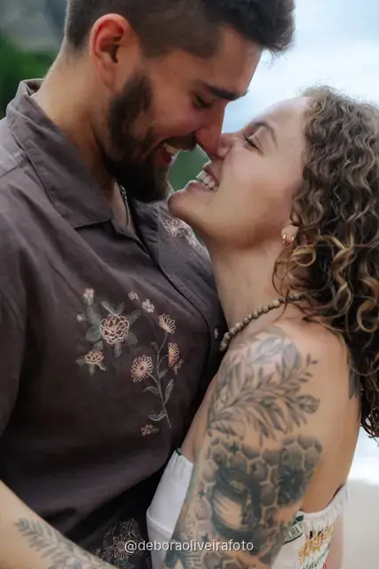 Close portrait of a couple embracing at Praia Vermelha in Rio de Janeiro