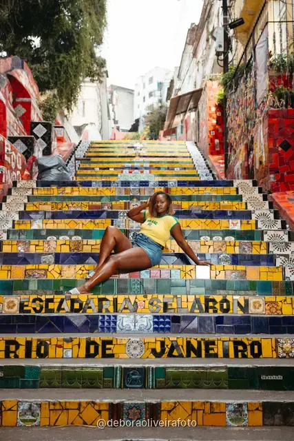 Woman in a yellow Brazil outfit at the Selarón Steps in Santa Teresa, Rio de Janeiro