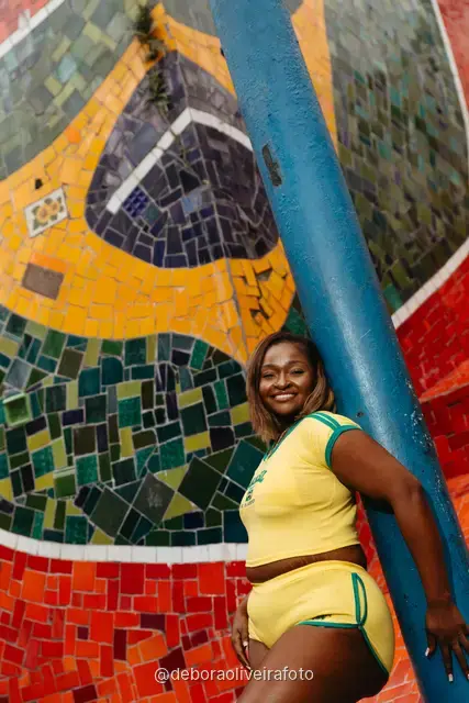 Woman in a yellow Brazil outfit at the Selarón Steps in Santa Teresa, Rio de Janeiro